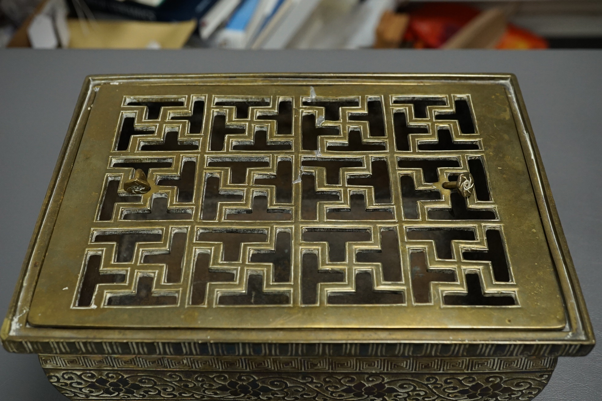 A large Chinese bronze rectangular censer and cover, Xuande seal mark, and a ‘plum blossom and chilong’ bronze censer, both 19th century